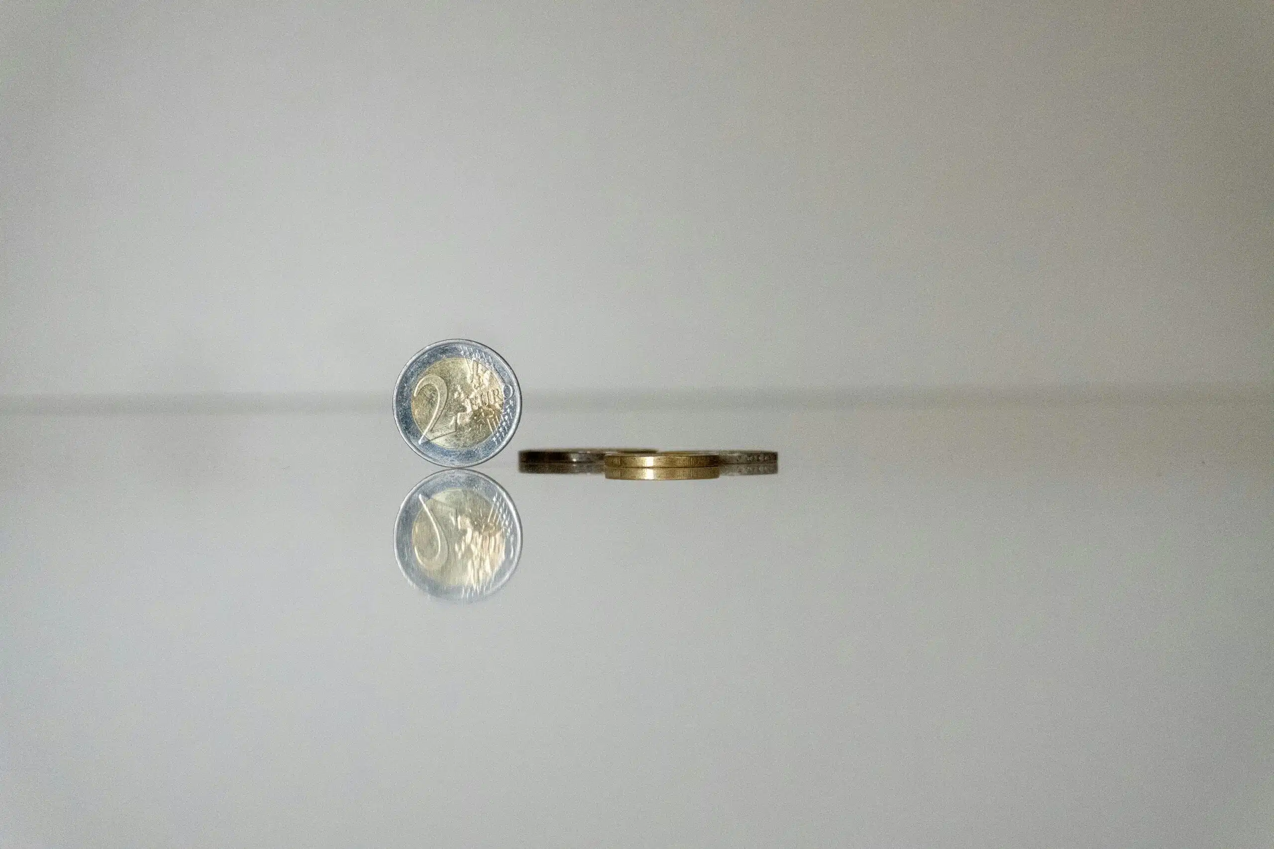 a gold ring with a coin on top of it